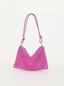 Detail of rose pink rhinestone shoulder bag showing knotted strap and sparkling crystals