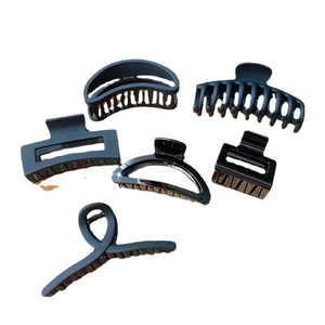 Set of six matte black claw clips in various geometric shapes for elegant hair styling