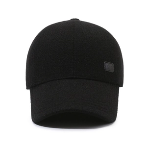 Classic black wool baseball cap for men featuring side ear flaps and a small leather patch