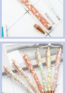 Exploded view of floral retractable ballpoint pen with rose gold metal parts and ink refill