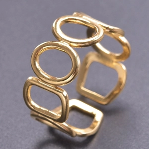 Detail view of adjustable hollow geometric gold ring with polished 18K gold finish
