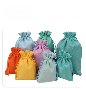 Detailed view of colorful linen drawstring bags for jewelry and cosmetic storage