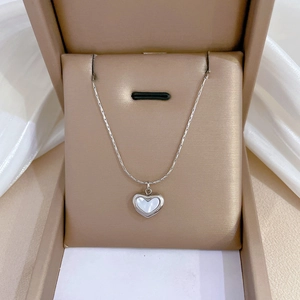 Silver heart necklace with mother of pearl inlay displayed in a premium gift box