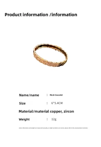 Macro detail of a gold rhombic pattern bangle with zircon stones on a white background