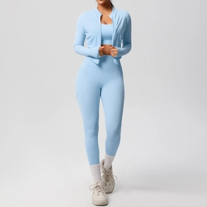 Three-piece light blue fitness set including zip-up jacket, sports bra, and yoga pants