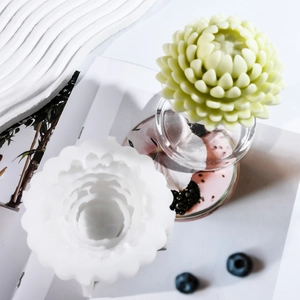 Detailed view of white silicone lotus flower mold with a 3D succulent candle craft piece