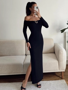 Detail of off-shoulder neckline with metal ring buckle on chic black slim fit dress