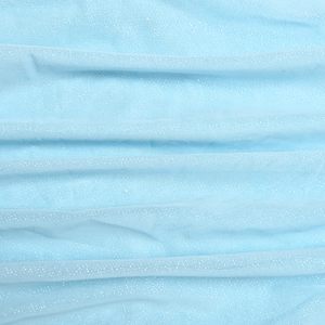 Close-up of light blue mesh fabric featuring shimmering silver glitter and soft textures