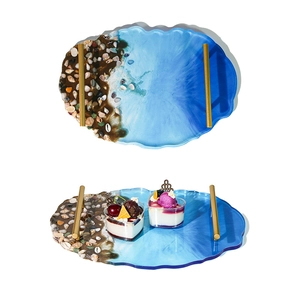 Irregular ocean wave resin tray mold with beach shell details and gold metal handles