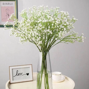Lifelike white artificial baby's breath flower bouquet in a clear glass vase for decor