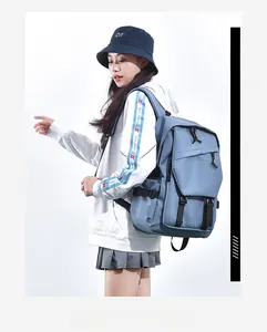 Blue functional nylon backpack showing side profile and large capacity pockets