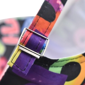 Detail of adjustable metal buckle and colorful graffiti strap on the cotton baseball cap