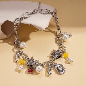 Vintage silver chain necklace with cross, pearl, star, and cowboy hat charms