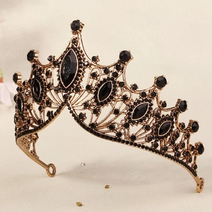 Close-up detail of golden bridal crown with black gemstones for vintage styling