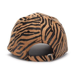 Detail of the zebra print baseball cap showing the adjustable silver metal buckle at the back