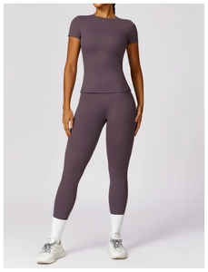 Detail of high-elastic purple yoga set showing slim fit short sleeve top and leggings