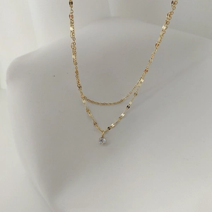 Double-layer gold titanium steel necklace with water wave chain and sparkling zircon pendant