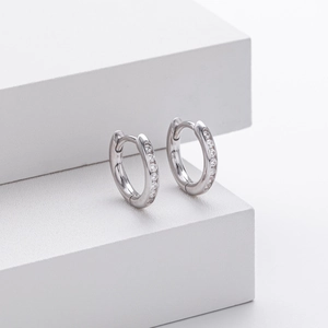 Detailed view of silver S925 sterling silver hoop earrings with cubic zirconia stones