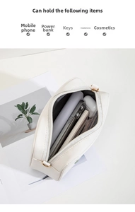 Internal view of white PU crossbody bag showing large storage capacity for accessories