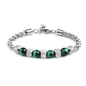 Detail of green tiger eye beads and silver mesh spacers on braided steel bracelet