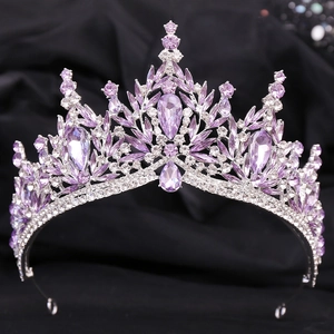 Detailed macro view of silver leaf bridal crown with purple crystals and sparkling rhinestones