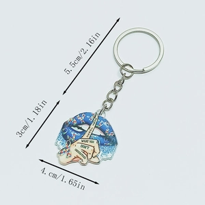Detail view of autism awareness acrylic keychain with dimension markers in inches and cm