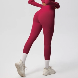 Detail view of high-waist yoga leggings with side pockets and butt-lifting seam design