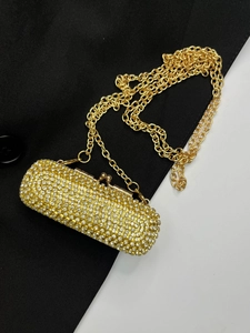 Mini crystal lipstick crossbody bag in luxurious gold finish with elegant metal chain