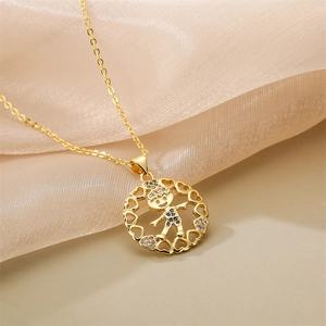 Detailed close-up of a golden necklace with a heart-rimmed boy pendant on silk fabric