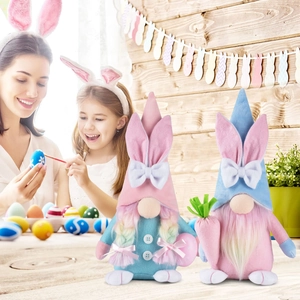 Easter Gnomes set with bunny ears holding carrot and egg for festive home party decoration