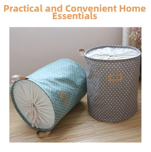 Detail of drawstring closure and leather handles on polka dot canvas laundry baskets