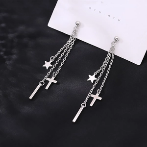 Minimalist silver chain earrings with cross, star and bar tassels on black silk