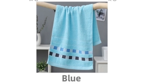 Detailed view of light blue cotton towel with checkered hem hanging on a wooden rod