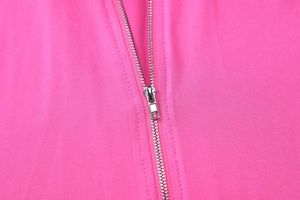 Detail of the high-quality metal zipper and stitching on this magenta hooded tracksuit set