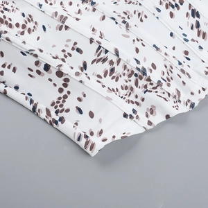 Detail of leopard print corset top showing vertical boning structure and polyester fabric