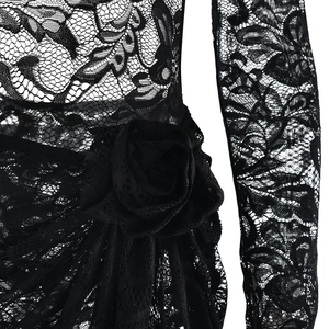 Detailed view of black lace dress featuring a 3D floral waist embellishment and mesh texture