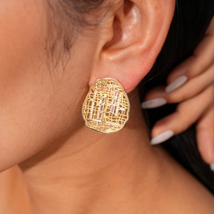 Macro view of 18k gold-plated irregular oval stud earrings with zircon mesh details