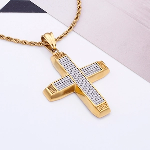 Macro shot of 18K gold plated hip-hop cross pendant set with sparkling zircon stones