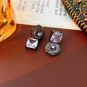 Detailed view of vintage rose flower earrings with square zircon and gunmetal finish
