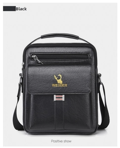 Detailed front view of black leather shoulder bag with golden logo and textured finish