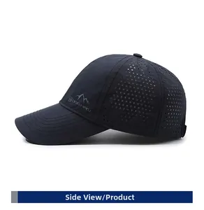 Detail view of side vents and mountain graphic on navy quick-dry outdoor baseball cap