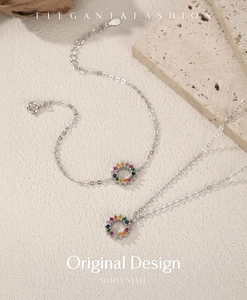 Detail of S925 silver necklace and bracelet set with rainbow cubic zirconia stones
