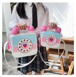 Creative telephone shaped crossbody bag showing comparison of large and small sizes