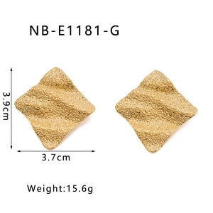 Detailed view of square geometric wave textured earrings with 18k gold plating details