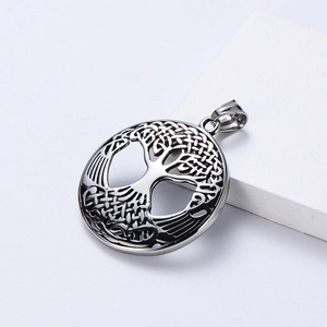 Nordic Viking tree of life pendant in polished silver stainless steel on white pedestal