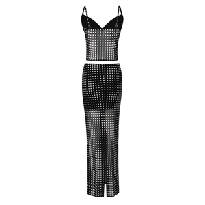 Detail of black mesh two-piece set featuring white polka dots and sheer fabric texture