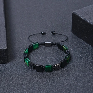 Detail of square malachite beaded bracelet with adjustable woven rope and metal clasp