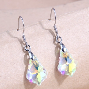 Iridescent maple leaf crystal drop earrings with silver hooks on textured background