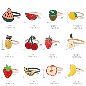 Assorted alloy fruit napkin rings set including watermelon and pineapple styles