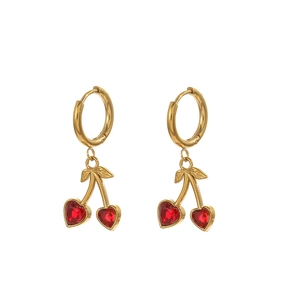 Detailed view of cherry earrings with golden stem and red heart-shaped gemstones